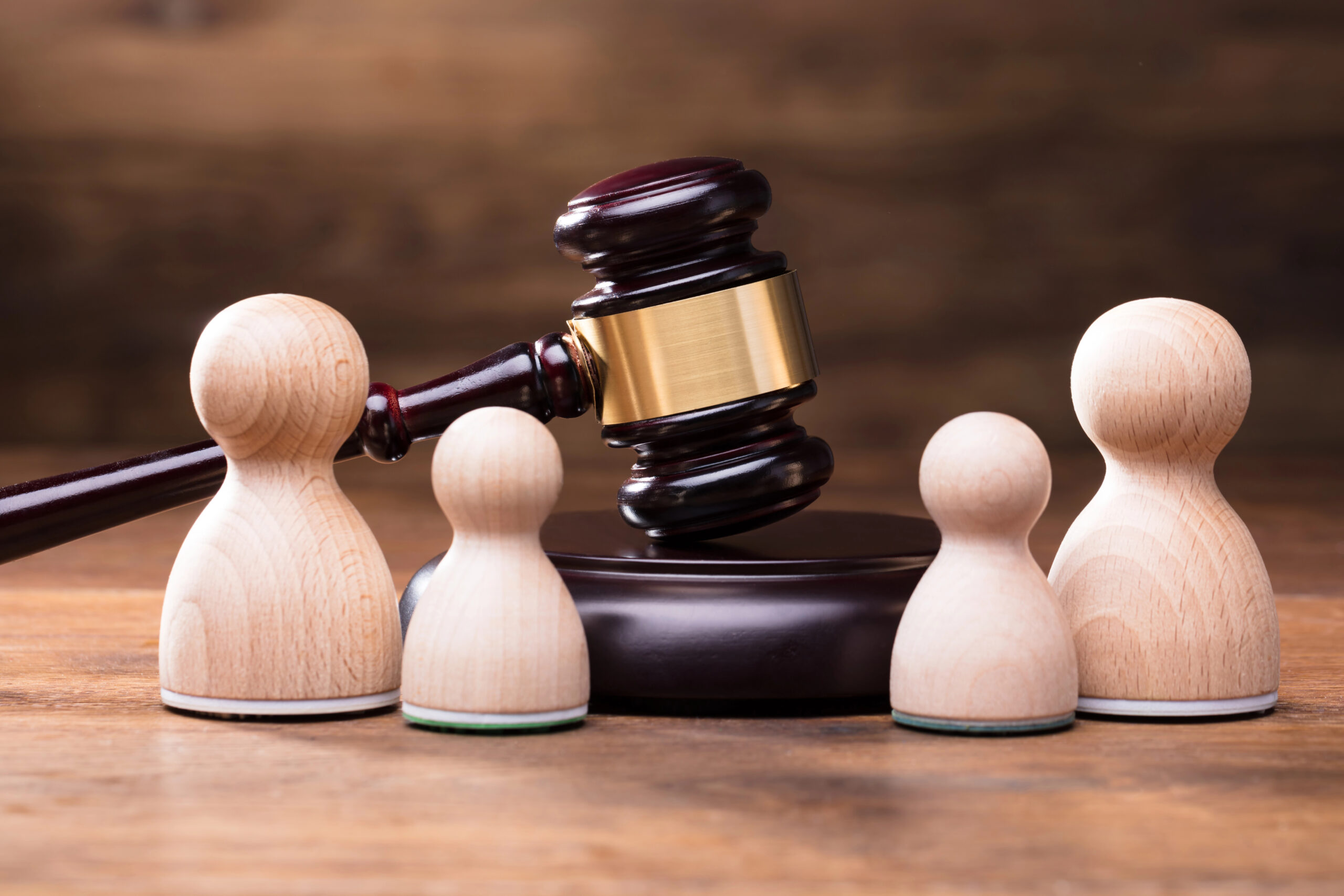 law books with a lady justice holding the scales of justice